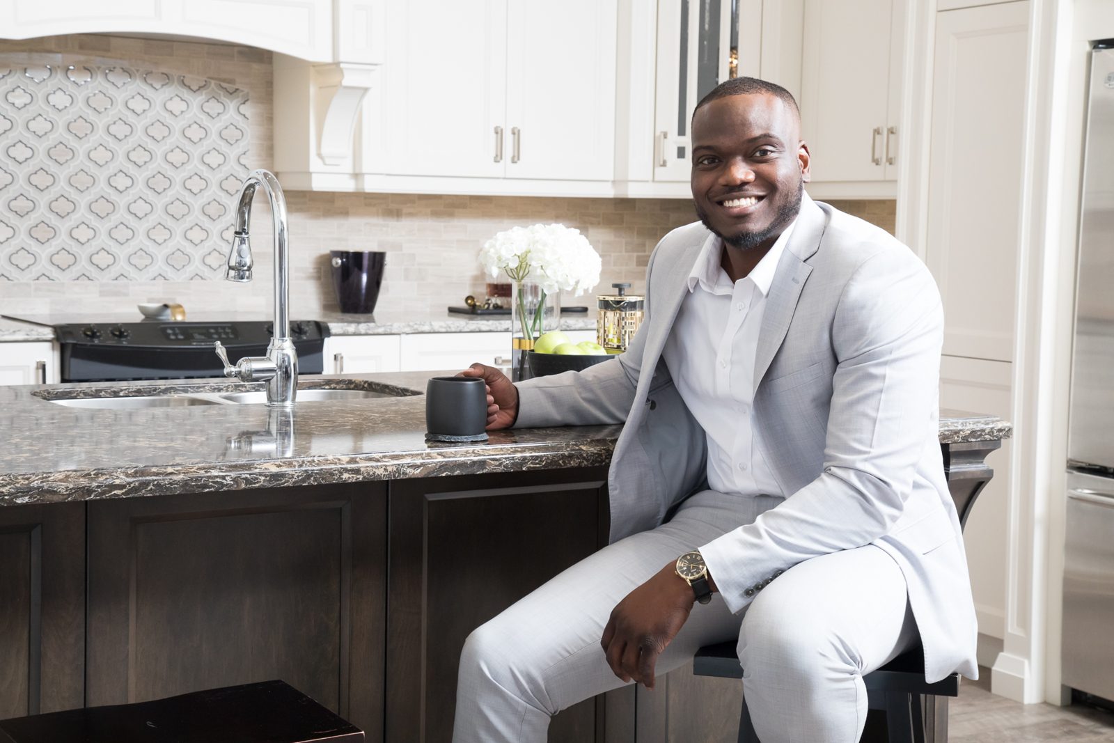 Kenneth Toppin at home with a coffee, the realtor and investor behind Ontario Landlord Hub